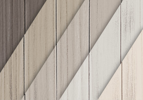 Sample display of luxury vinyl plank flooring in various wood shades for modern home design